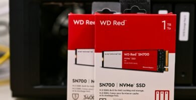 two red and white boxes sitting on top of a wooden table